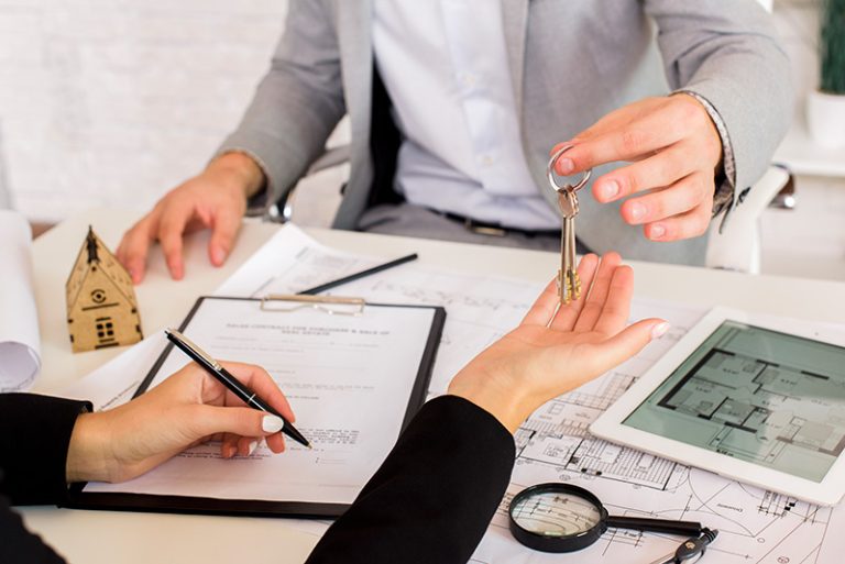 Man giving some keys to woman